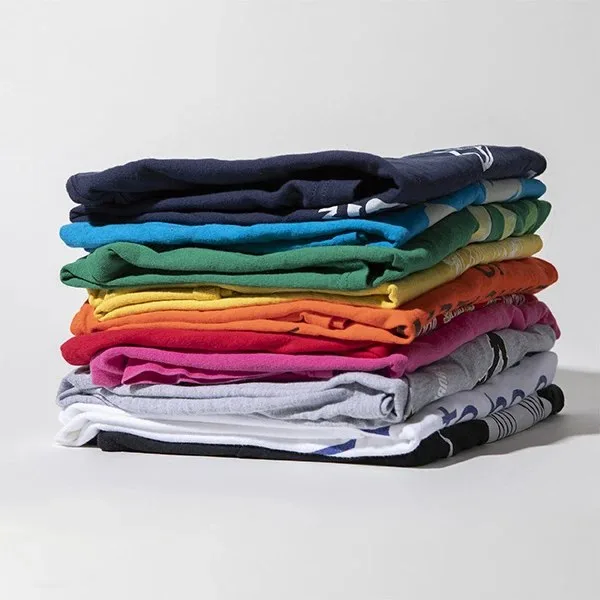 A neat stack of folded t-shirts in many bright colors